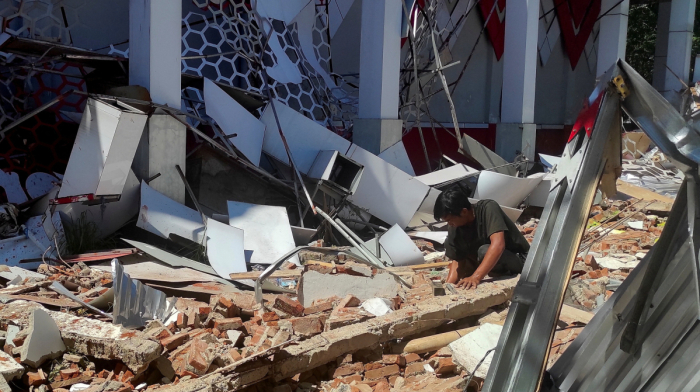 Indonesia earthquake triggers tsunami waves, damages buildings