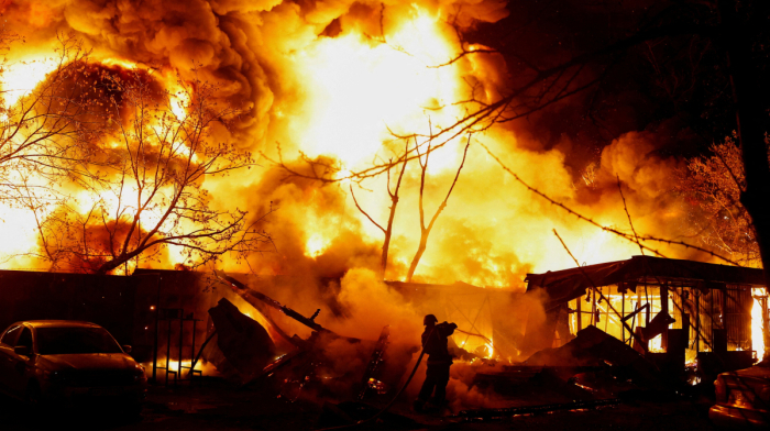 Russian missiles hit Kyiv and other Ukrainian cities killing 13 people as Ukrainian strikes in Russia kills two children