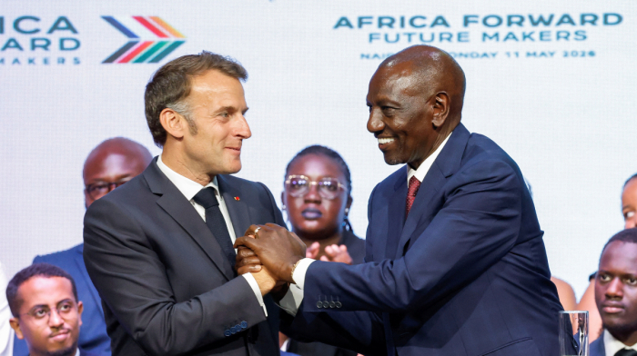 Macron opens first French business summit in English-speaking African nation