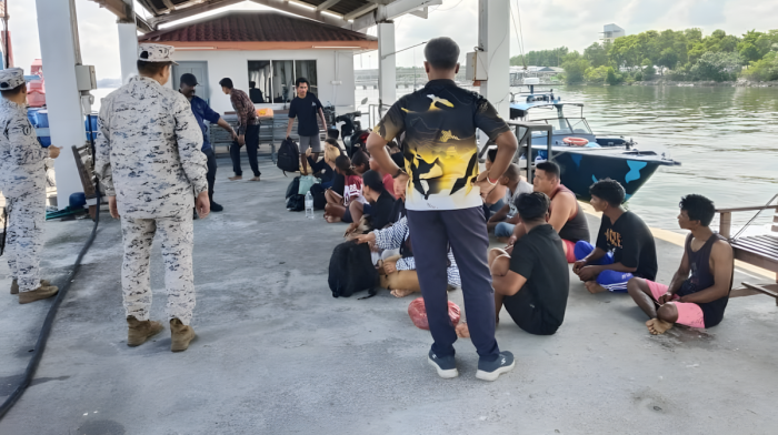 Malaysia searches for 14 missing people after migrant boat capsizes