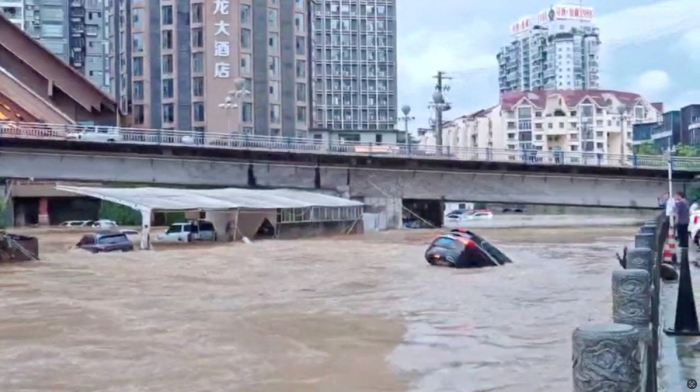 China floods kill at least 21 as storms batter south and central regions