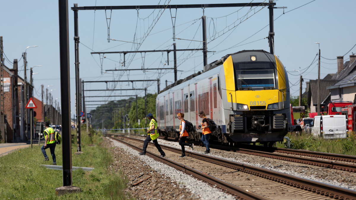 At least four dead, including two teenagers, after train collides with school bus in Belgium
