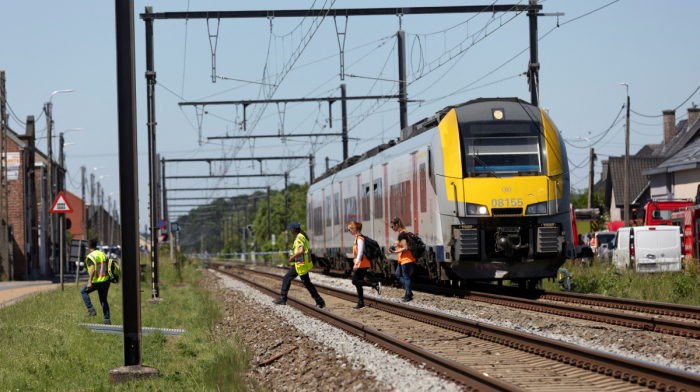 At least four dead, including two teenagers, after train collides with school bus in Belgium