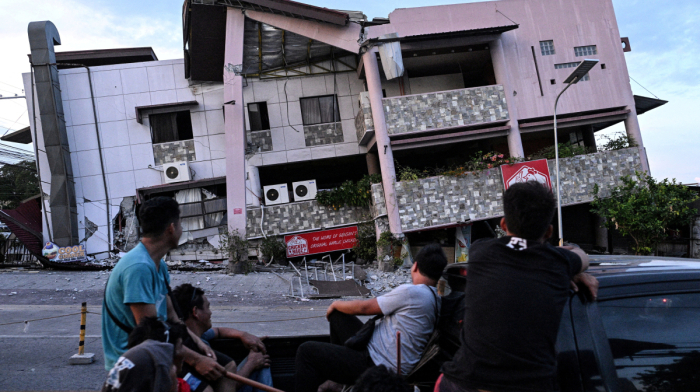 Death toll rises as rescuers search collapsed building after Philippines quake