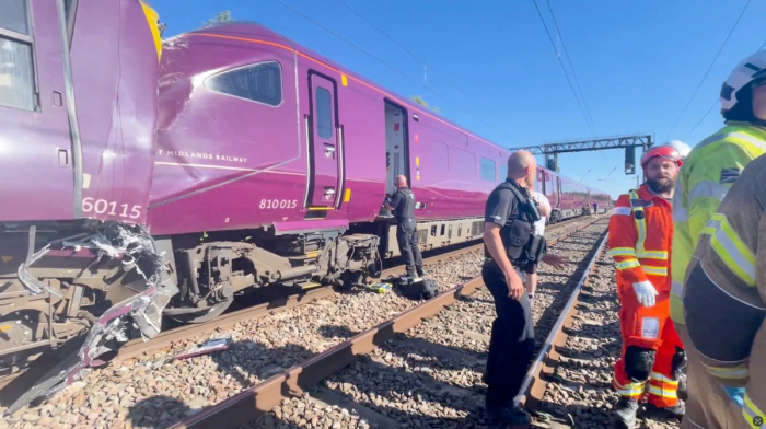 Driver killed after UK trains collide, with nine people in critical condition