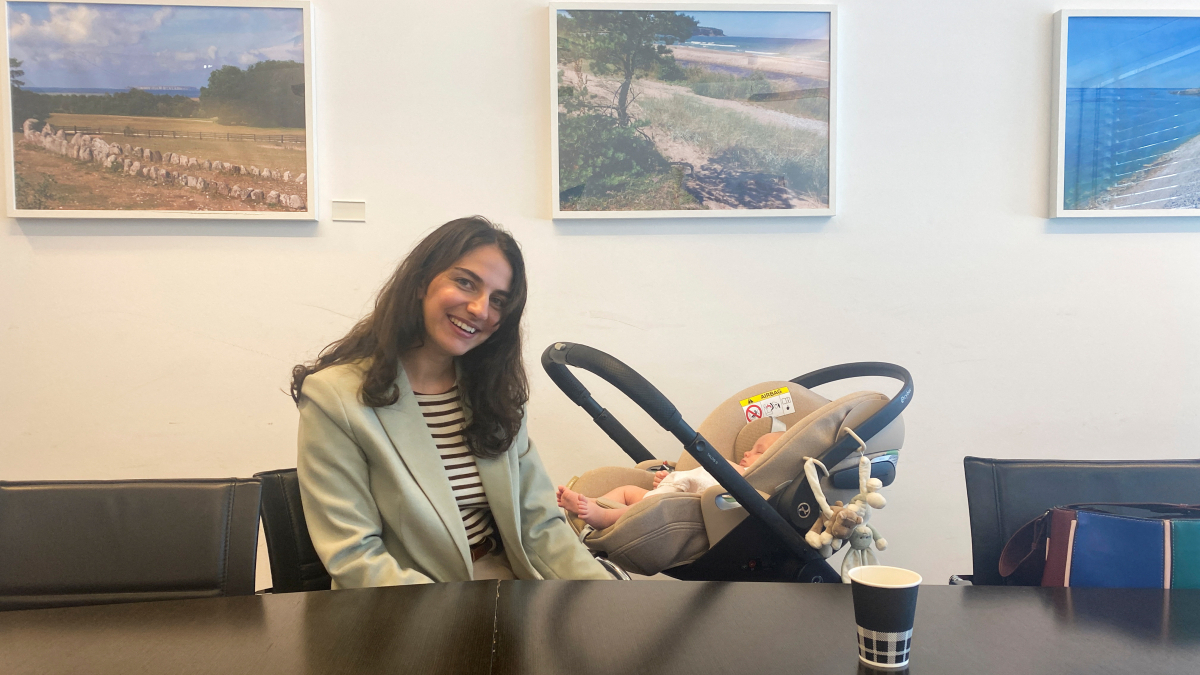 Swedish minister brings baby to EU meeting to spotlight parental leave