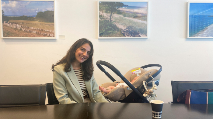 Swedish minister brings baby to EU meeting to spotlight parental leave