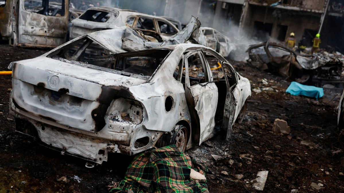 Russian attack on Kyiv kills at least nine as rescue efforts continue