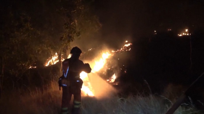 Firefighters tackle flames at wildfire in Spain hampered by strong winds