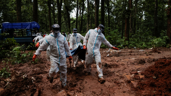 Hundreds of unidentified flood victims buried as Nepal searches for missing