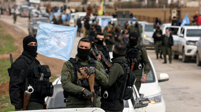 Syria says armed factions integrated into national army as government pushes state control