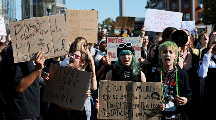 Belgian police use tear gas and water cannon as students join nationwide strike