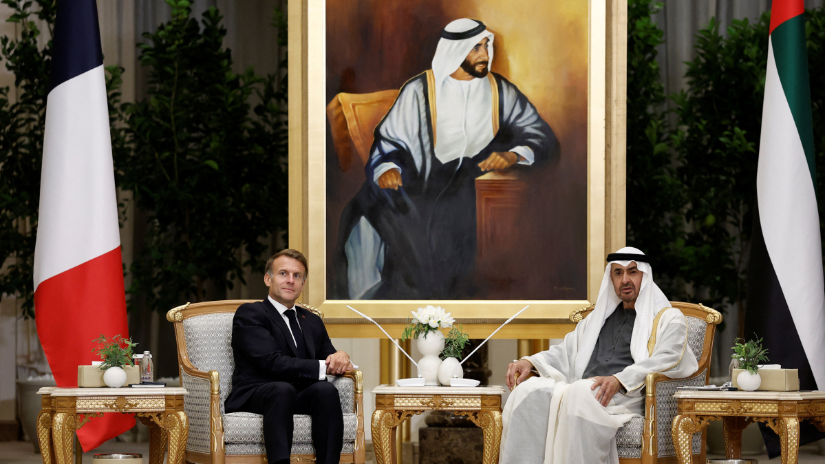 Why is Macron visiting the UAE amid protests in France?