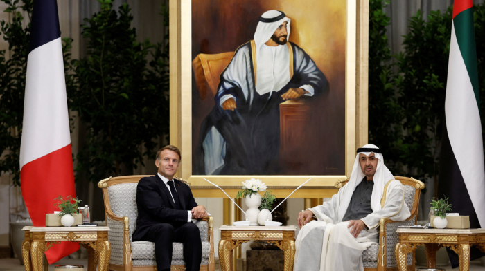Why is Macron visiting the UAE amid protests in France?