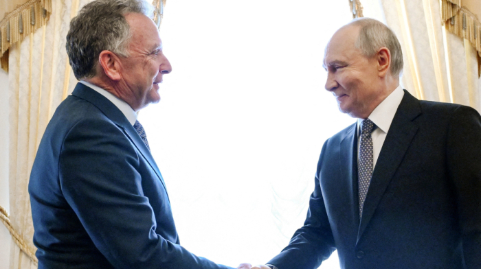 Putin signals willingness for trilateral talks, frees retired American teacher